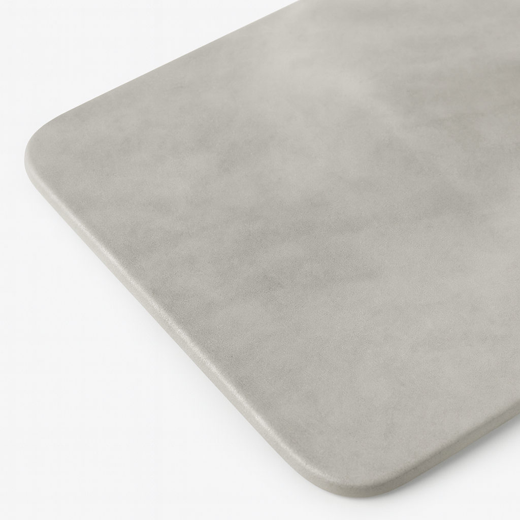 Rechthoekige mat met een glad oppervlak en afgeronde hoeken.