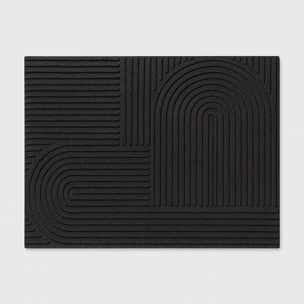 Rechthoekige deurmat met reliëf geometrisch patroon.