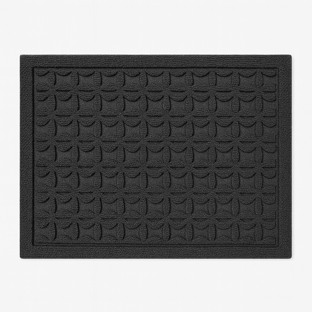 Rechthoekige deurmat met reliëf geometrisch patroon.