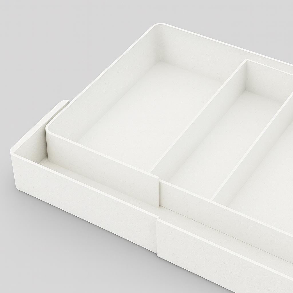 Acryl keukenlade-organizers met bestek, gereedschap en kookaccessoires.